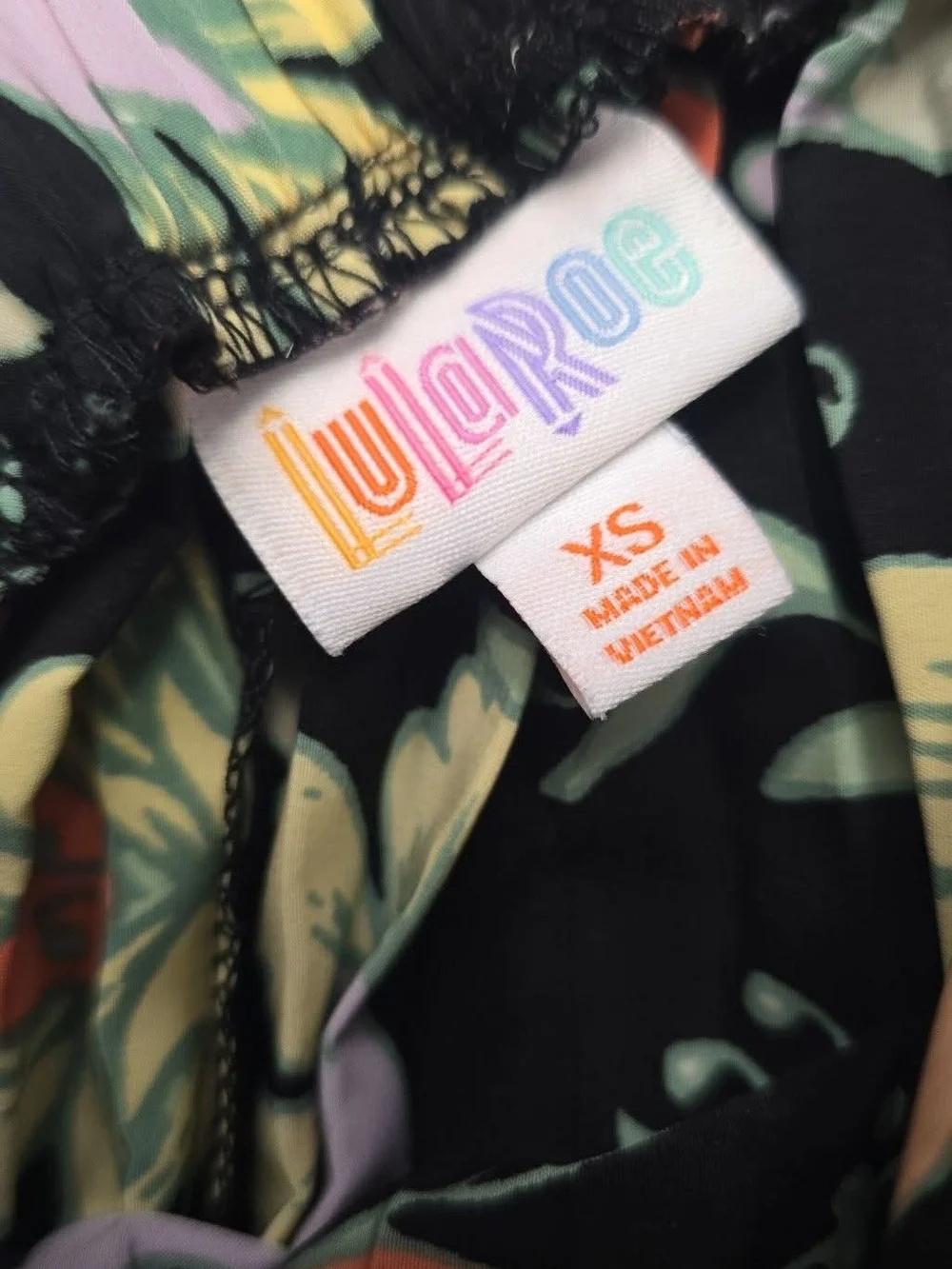 LuLaRoe Black Floral Print Top with Pastel Accents - Picture 2 of 2